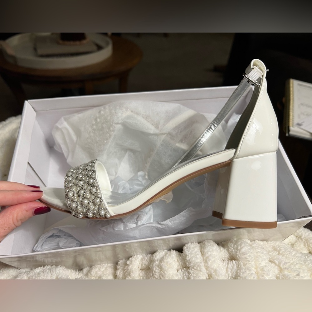 Brand new white heels, size 6
